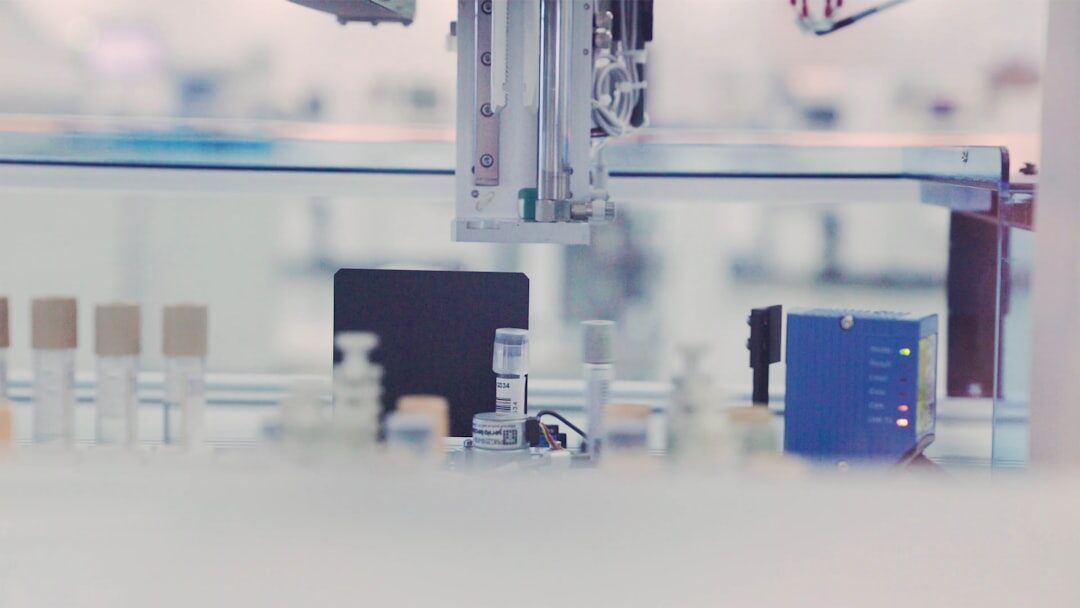 Modern white humanoid robot in a technology laboratory